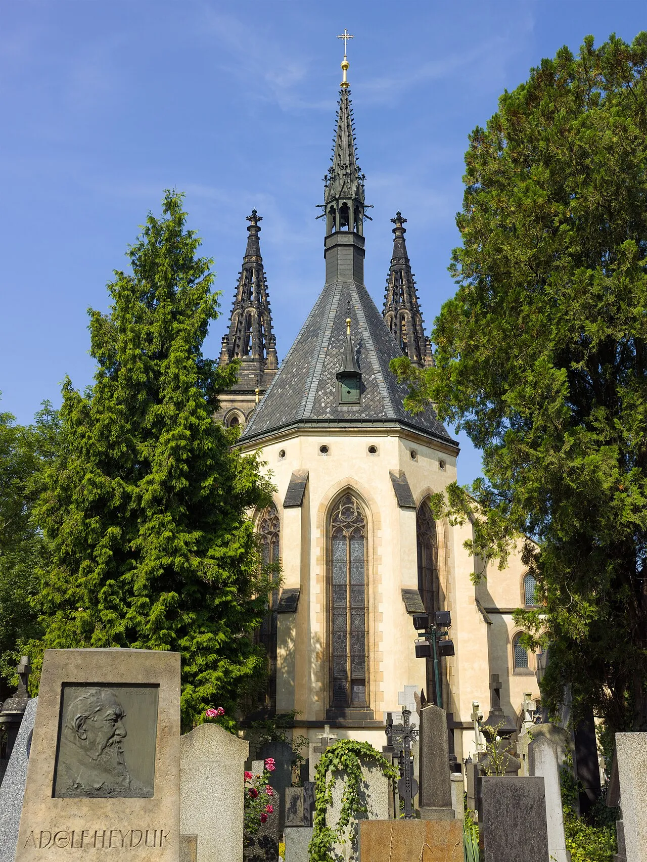 The rear of the Basilica of Saints Peter and Paul at Vyšehrad, with its twin towers above the trees